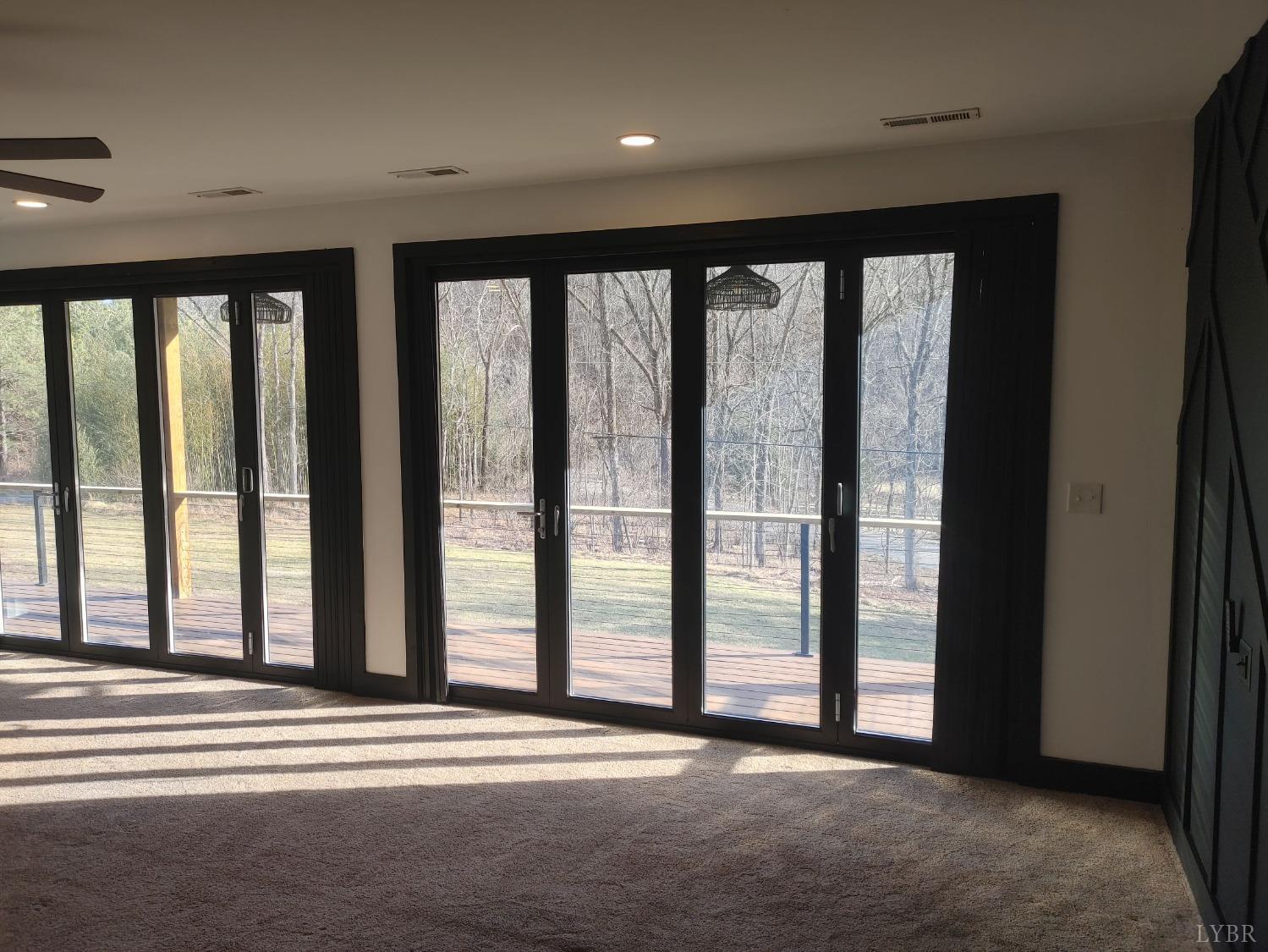 8915 Charlemont Road Goode, VA 24556 - Photo 44 of 96 a view of an empty room with wooden floor and a window