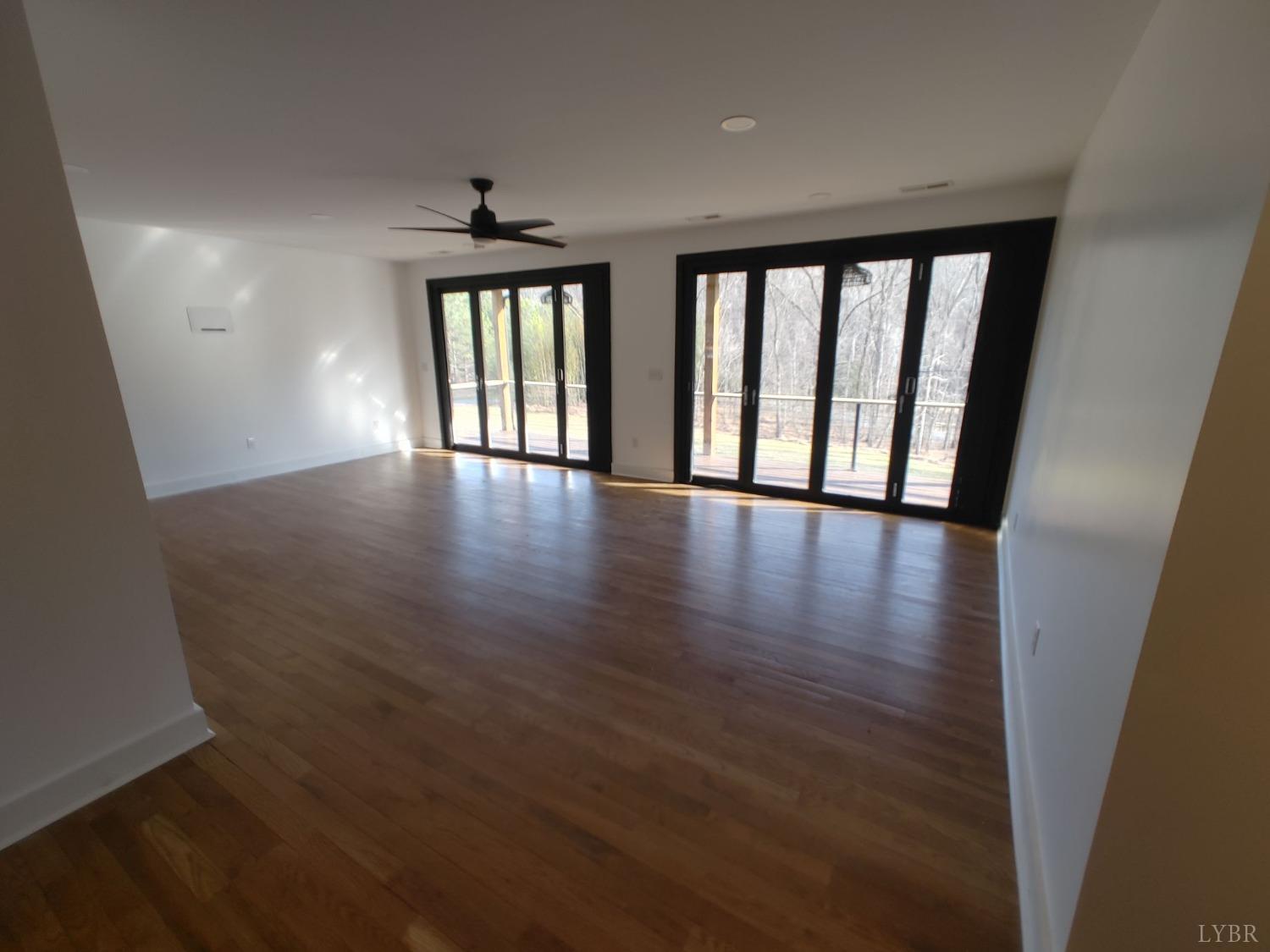 8915 Charlemont Road Goode, VA 24556 - Photo 65 of 96 wooden floor in an empty room with a window