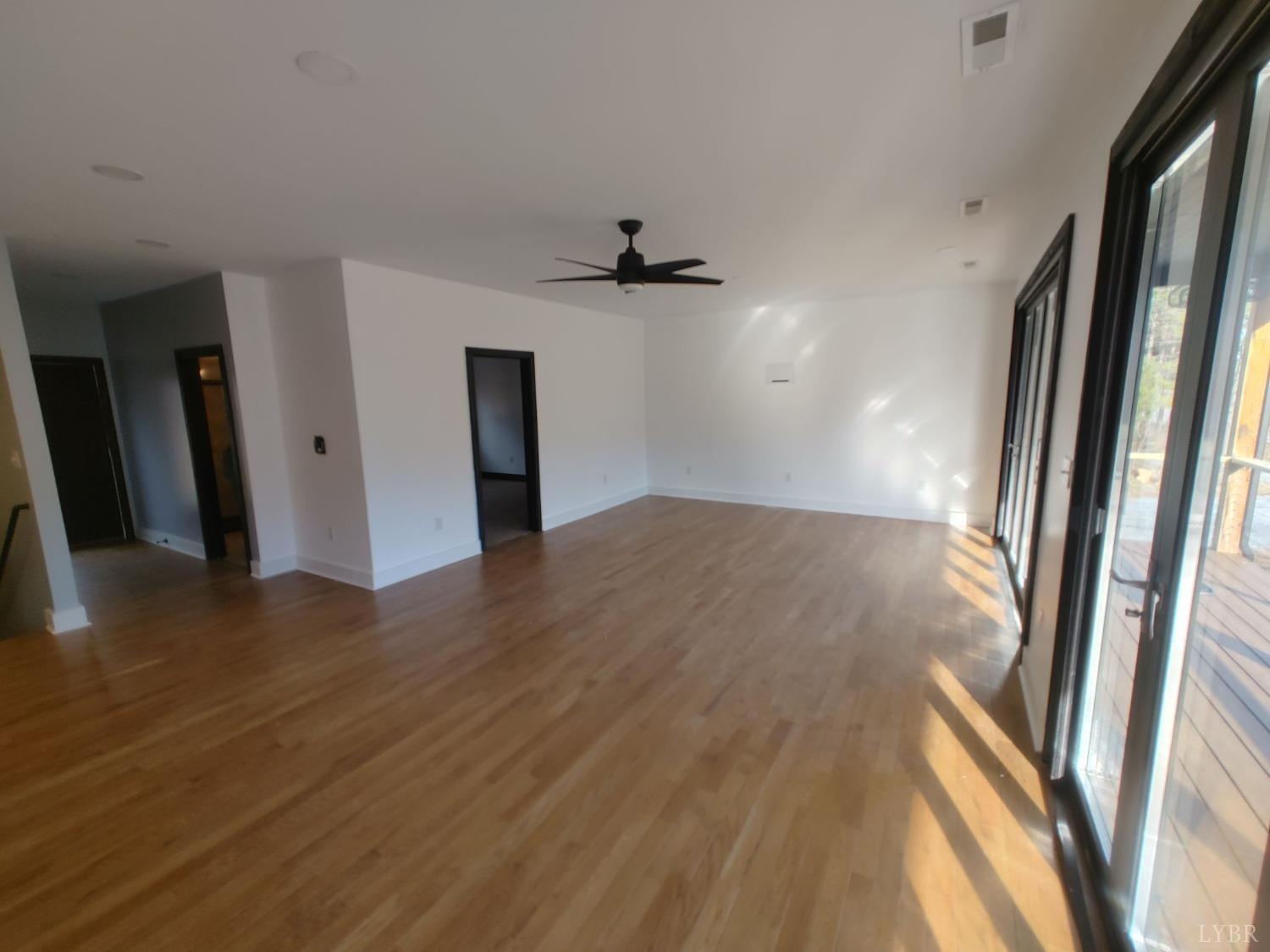8915 Charlemont Road Goode, VA 24556 - Photo 67 of 96 wooden floor in an empty room with a window