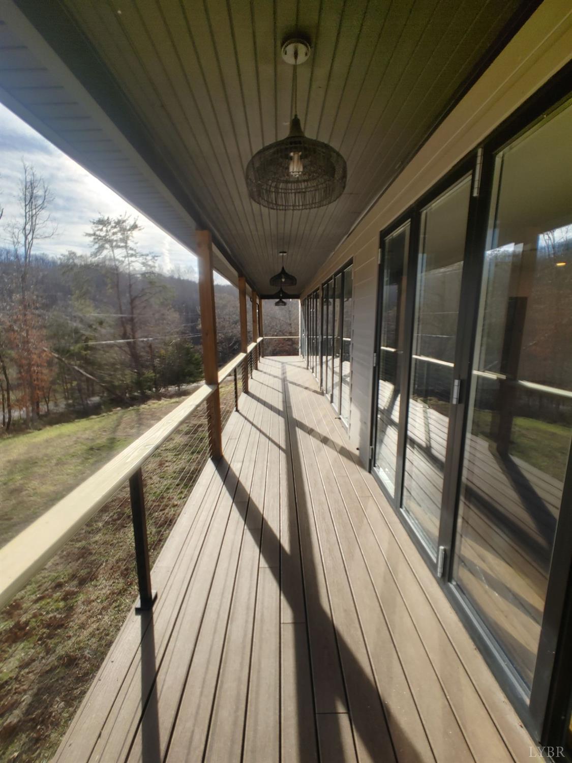 8915 Charlemont Road Goode, VA 24556 - Photo 73 of 96 a view of balcony with wooden floor