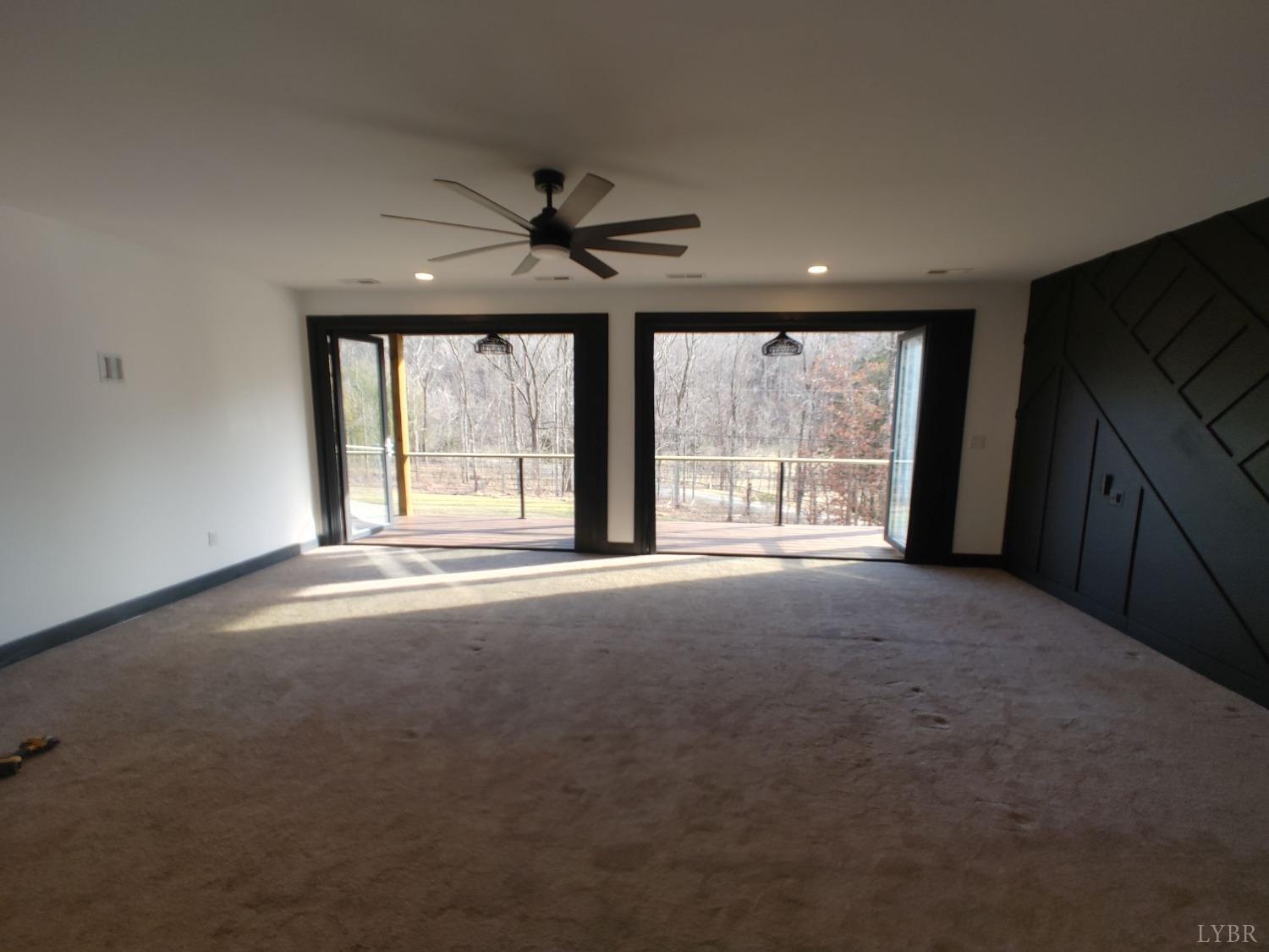 8915 Charlemont Road Goode, VA 24556 - Photo 77 of 96 a view of a livingroom with an empty space and a fireplace