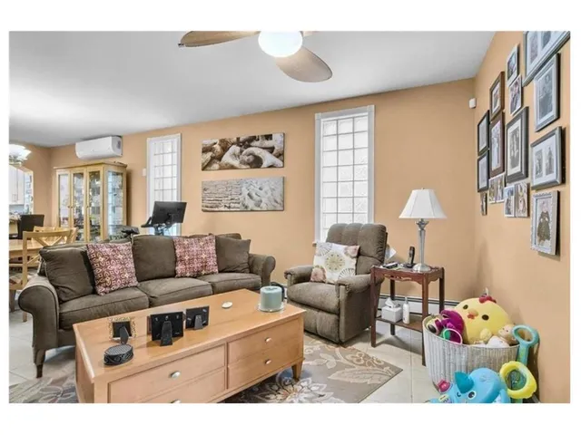 a living room with furniture and a window