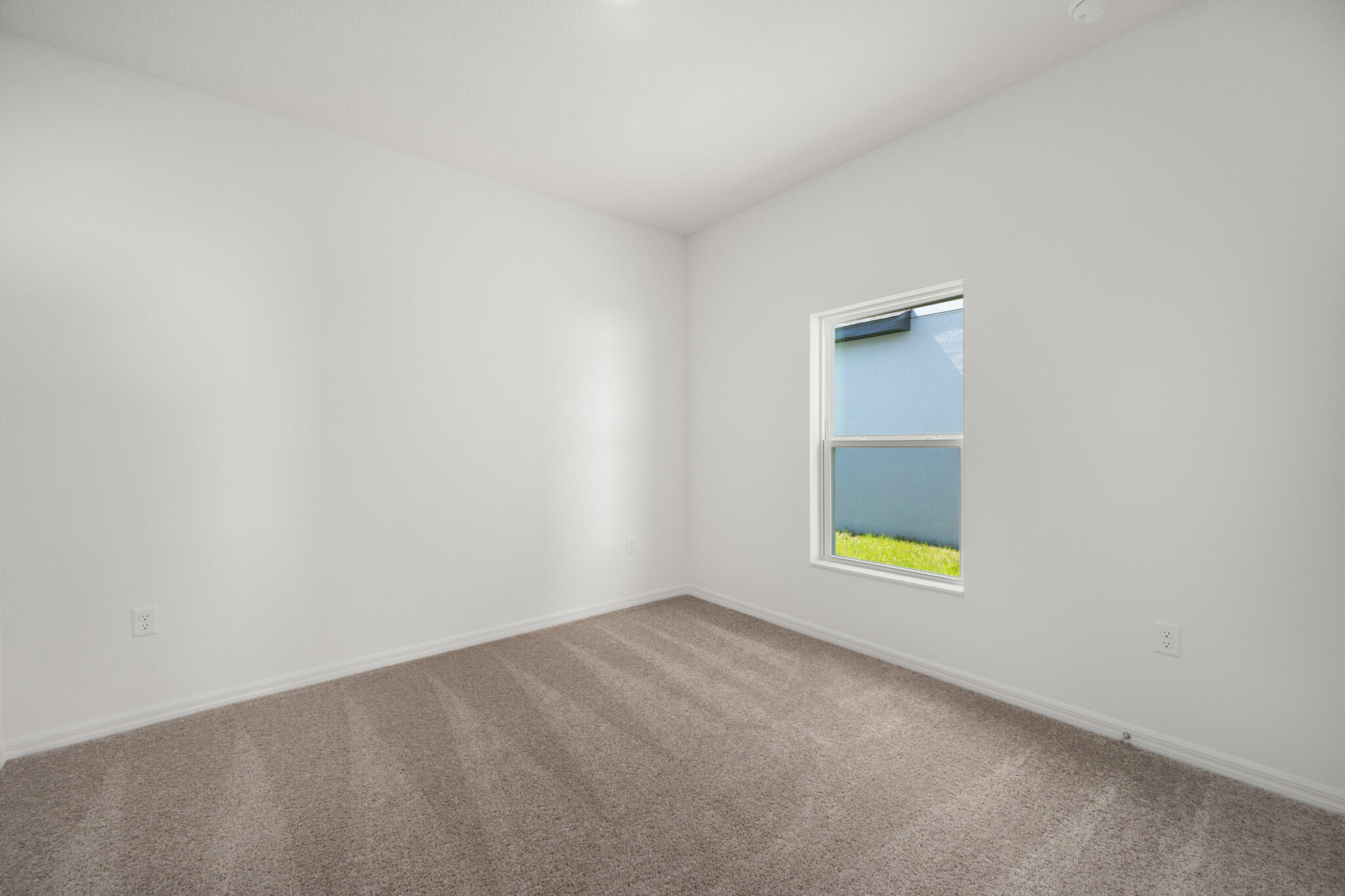 5019 Sunset Boulevard Fort Pierce, FL 34982 - Photo 19 of 20 a view of an empty room with a window