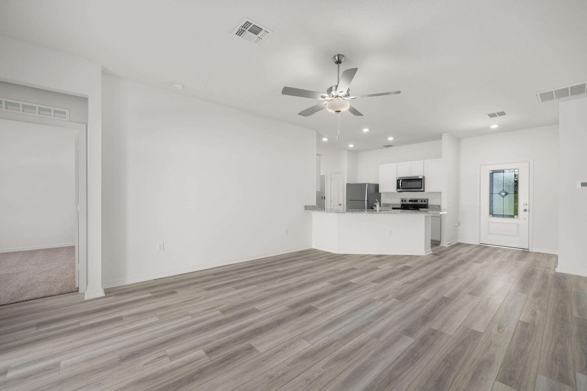 5019 Sunset Boulevard Fort Pierce, FL 34982 - Photo 6 of 20 a view of kitchen with cabinets and wooden floor