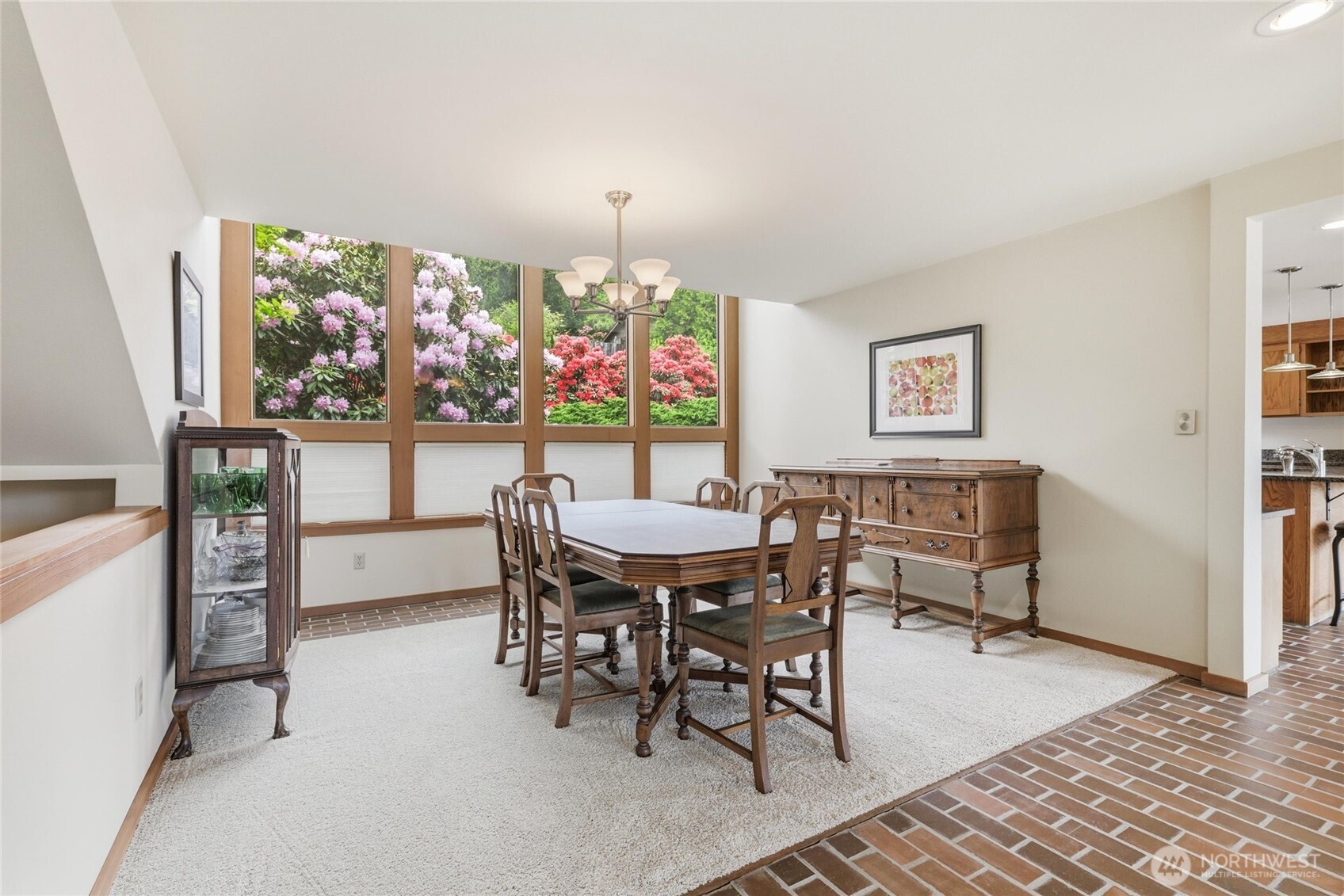 9520 Odin Way Bothell, WA 98011 - Photo 4 of 40 a view of a dining room with furniture and a floor to ceiling window