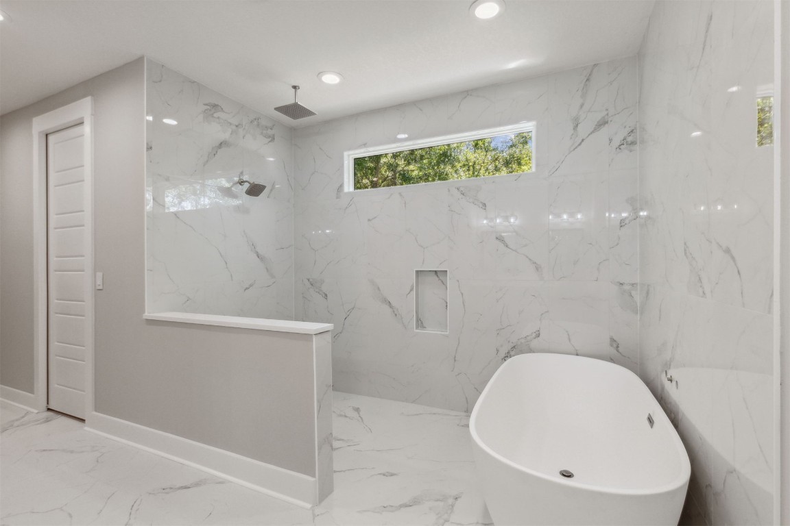 96050 Captains Pointe Road Yulee, FL 32097 - Photo 19 of 37 a bathroom with a granite countertop sink a toilet and shower