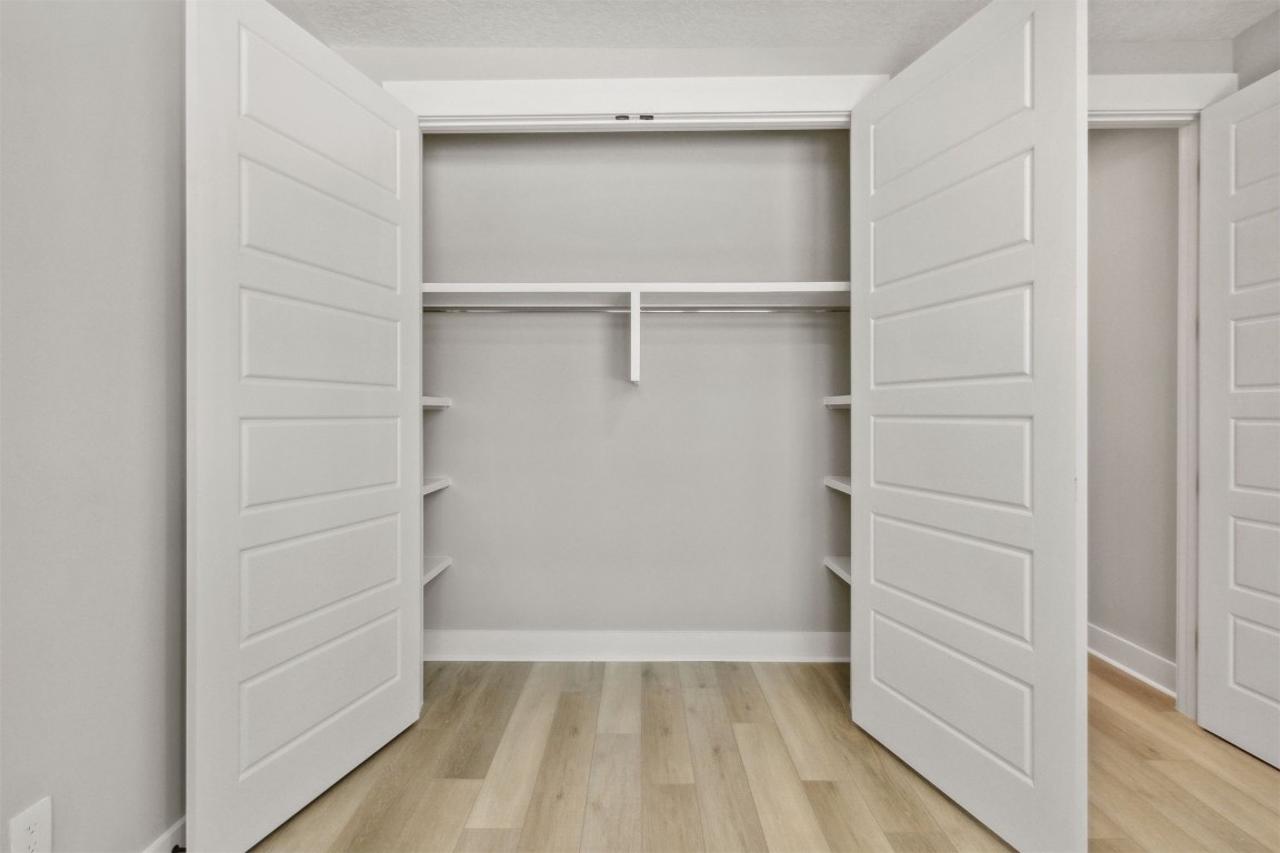 96050 Captains Pointe Road Yulee, FL 32097 - Photo 22 of 37 a view of walk in closet with empty racks