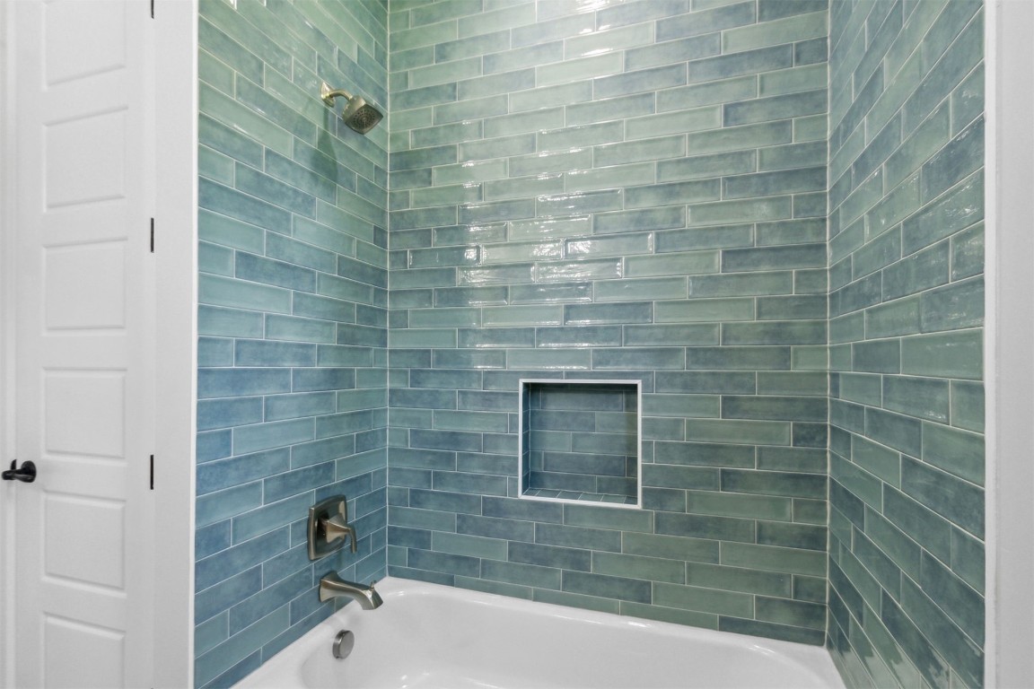 96050 Captains Pointe Road Yulee, FL 32097 - Photo 24 of 37 a bathroom with a bathtub and shower