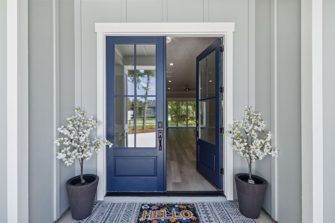96050 Captains Pointe Road Yulee, FL 32097 - Photo 3 of 37 a vase of flowers sitting on a table with window