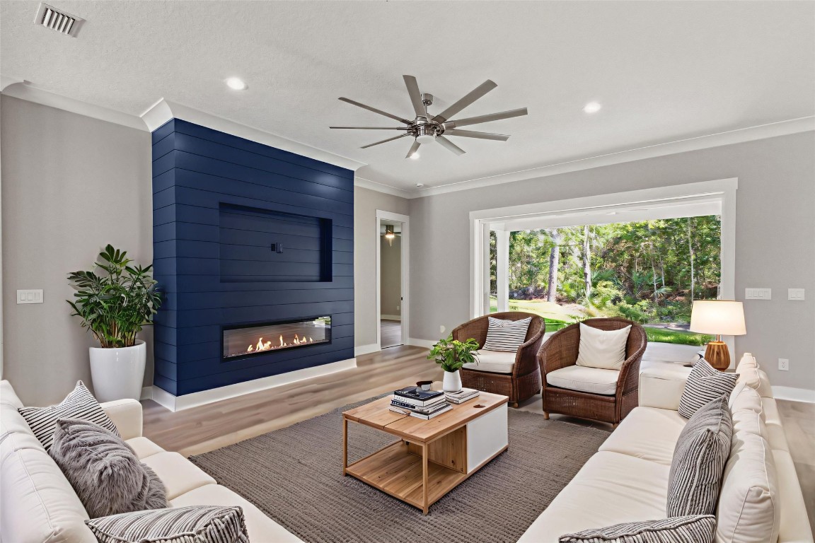 96050 Captains Pointe Road Yulee, FL 32097 - Photo 7 of 37 a living room with furniture and a fireplace
