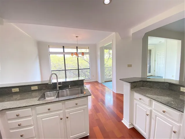 a view of a livingroom with a fireplace and window