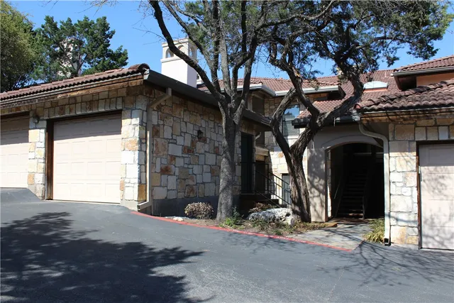 a view of a porch with chairs and backyard
