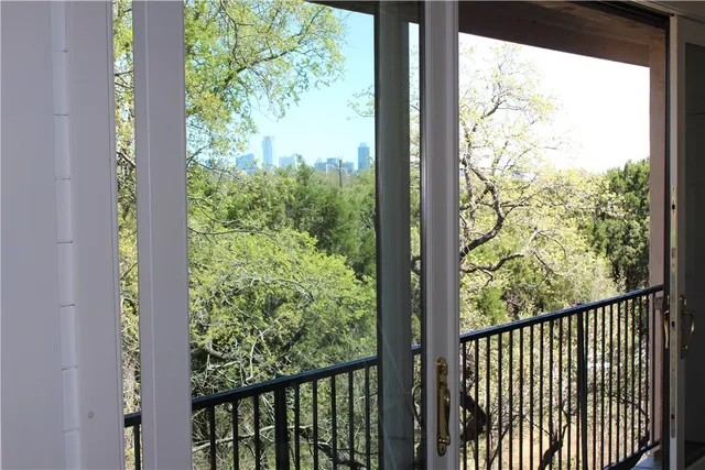 a view of a forest from a window