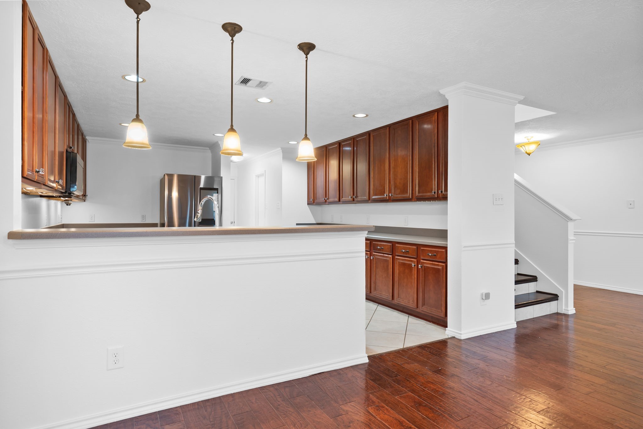 2810 Legends Knoll Drive Spring, TX 77386 - Photo 11 of 29 a kitchen with wooden floor and window