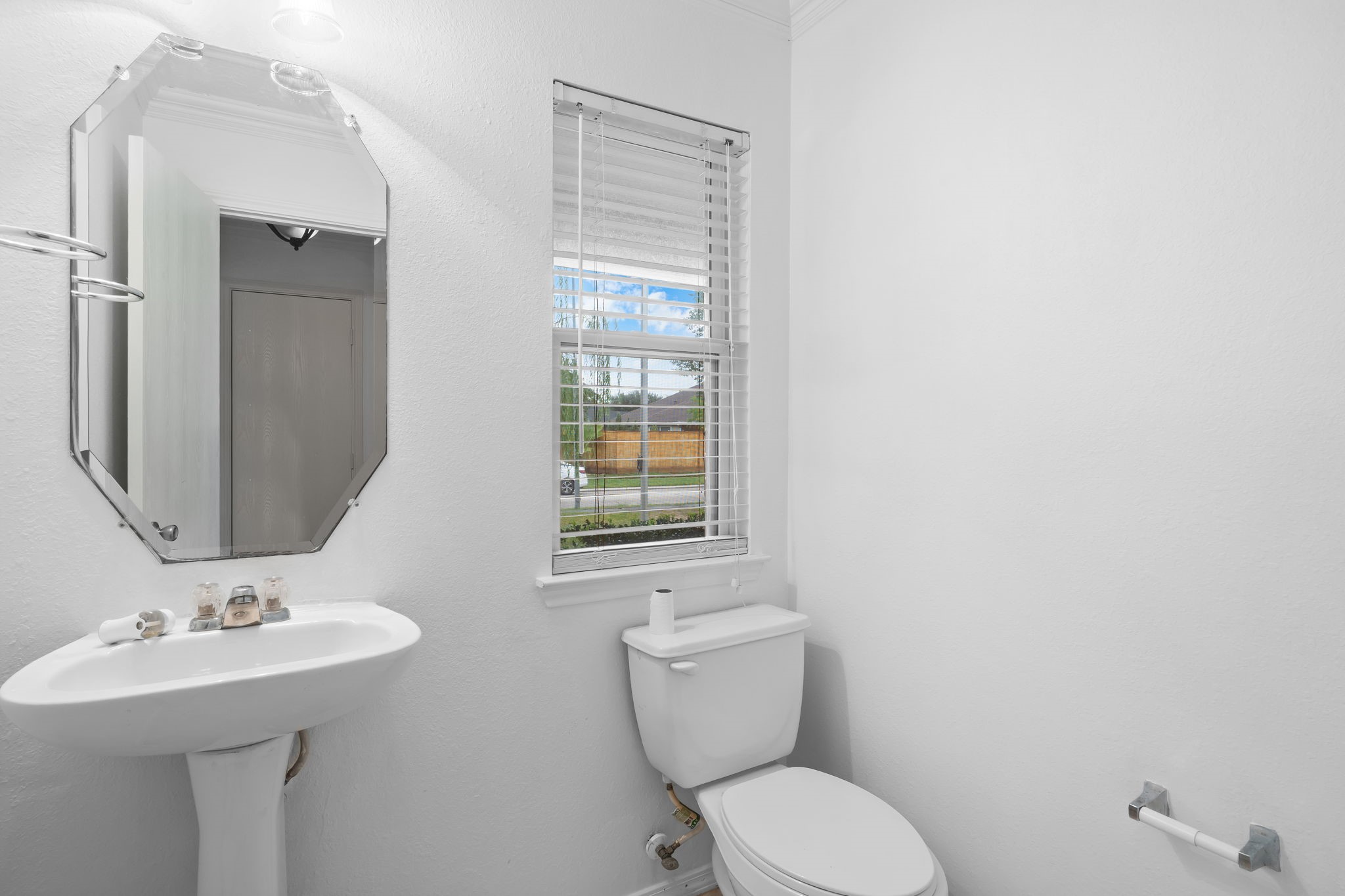 2810 Legends Knoll Drive Spring, TX 77386 - Photo 14 of 29 a bathroom with a toilet sink and mirror