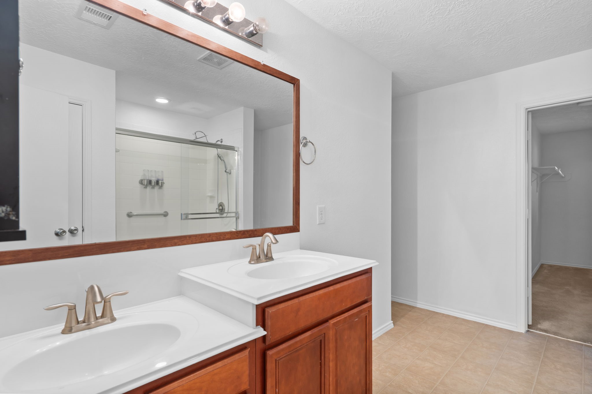 2810 Legends Knoll Drive Spring, TX 77386 - Photo 19 of 29 a bathroom with a sink and a mirror