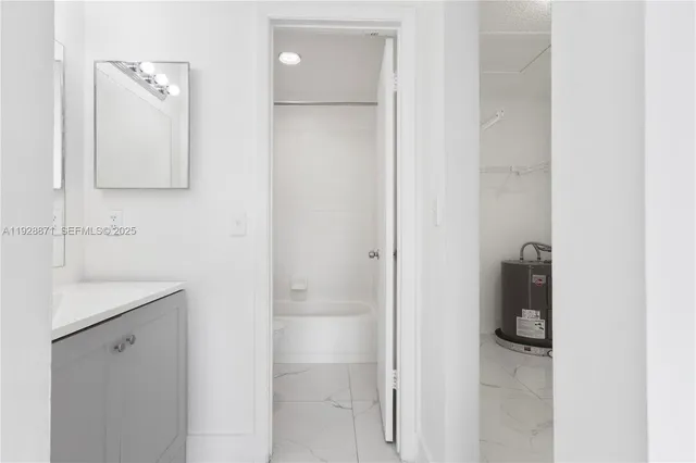 a bathroom with a shower and mirror