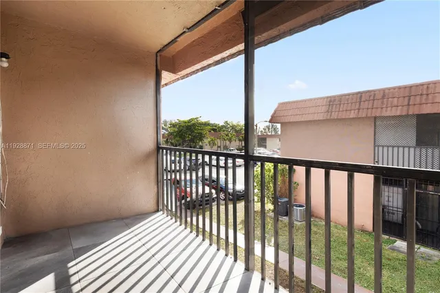 a view of a balcony with wooden floor