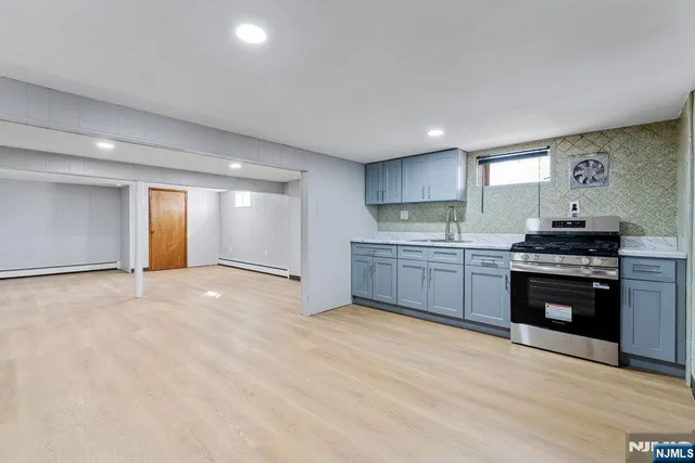 a bathroom with a sink vanity and a mirror