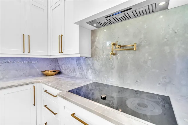 a kitchen with stainless steel appliances a refrigerator and a stove