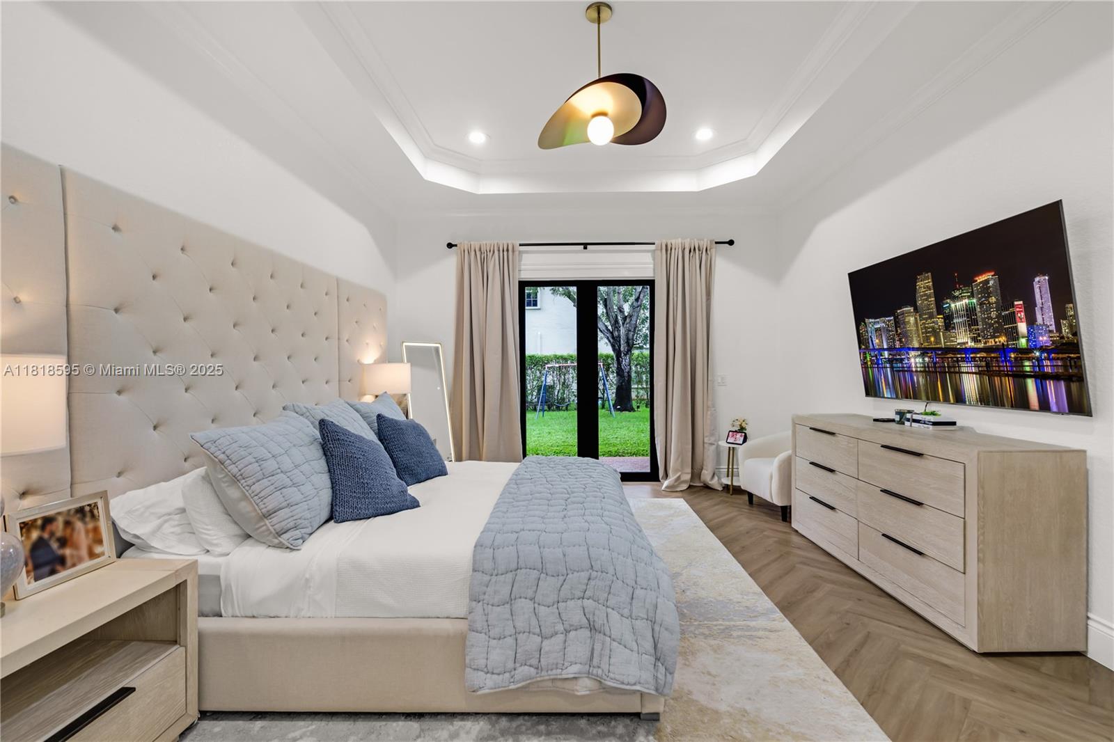 5478 Southwest 189th Avenue Miramar, FL 33029 - Photo 29 of 58 a bedroom with a bed a dresser and flat screen tv