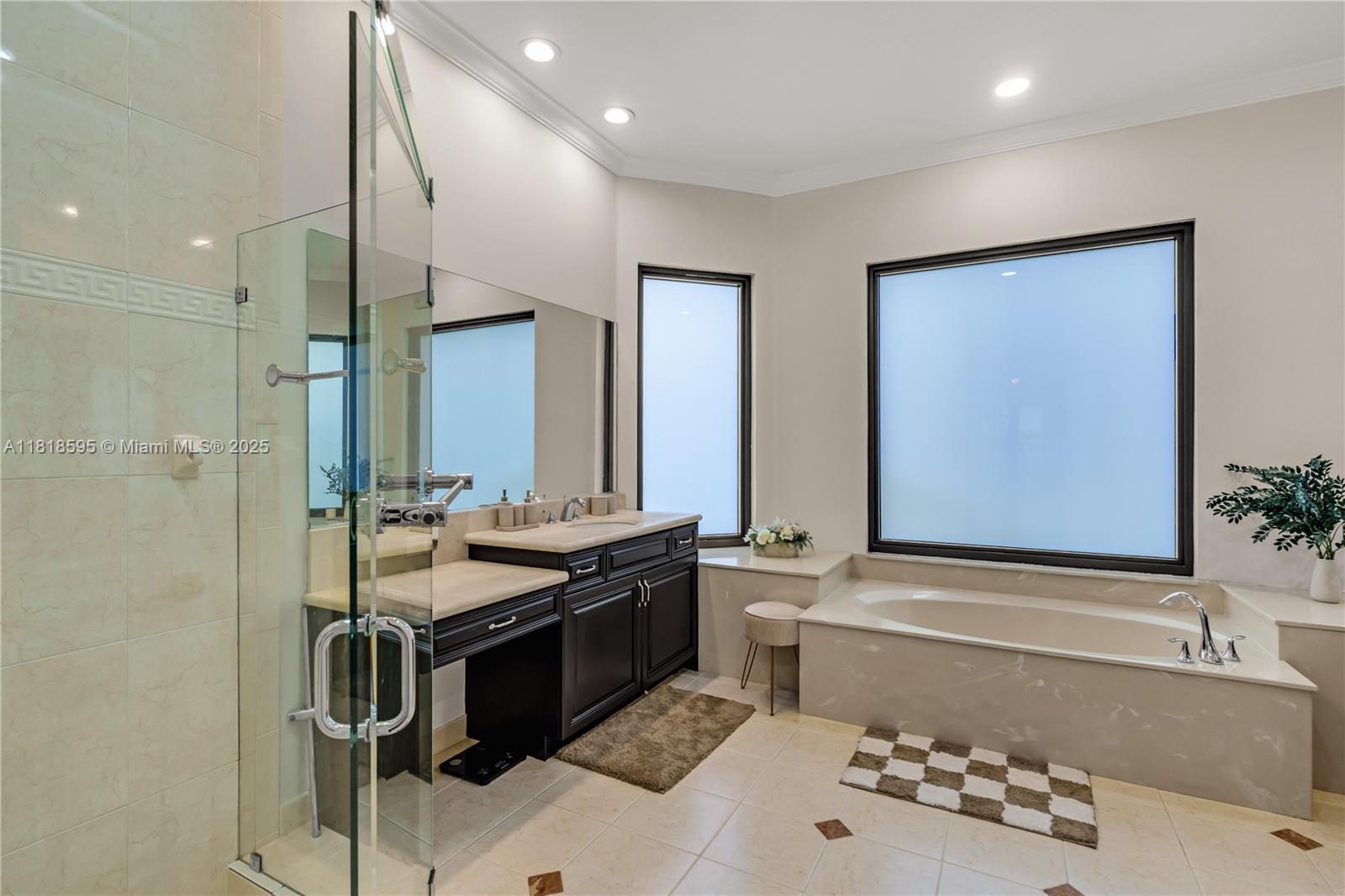 5478 Southwest 189th Avenue Miramar, FL 33029 - Photo 32 of 58 a bathroom with a tub sink and mirror