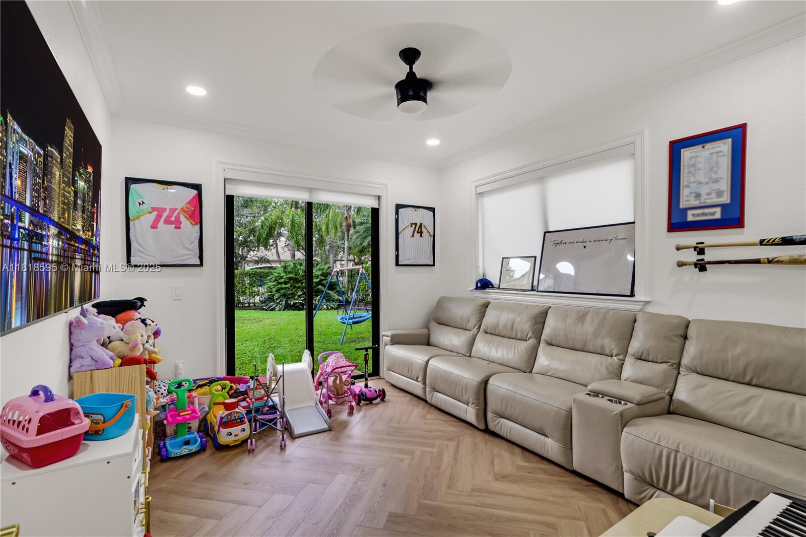 5478 Southwest 189th Avenue Miramar, FL 33029 - Photo 44 of 58 a living room with furniture toys and a flat screen tv