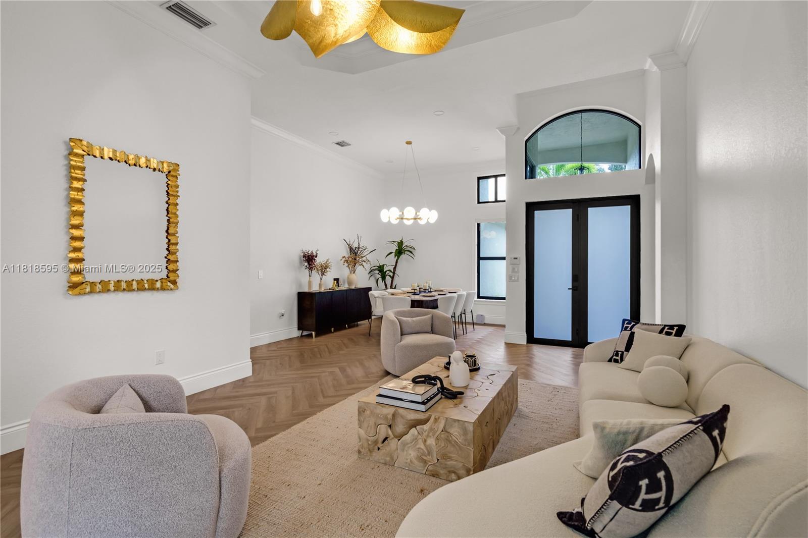 5478 Southwest 189th Avenue Miramar, FL 33029 - Photo 9 of 58 a living room with furniture a mirror and lamp