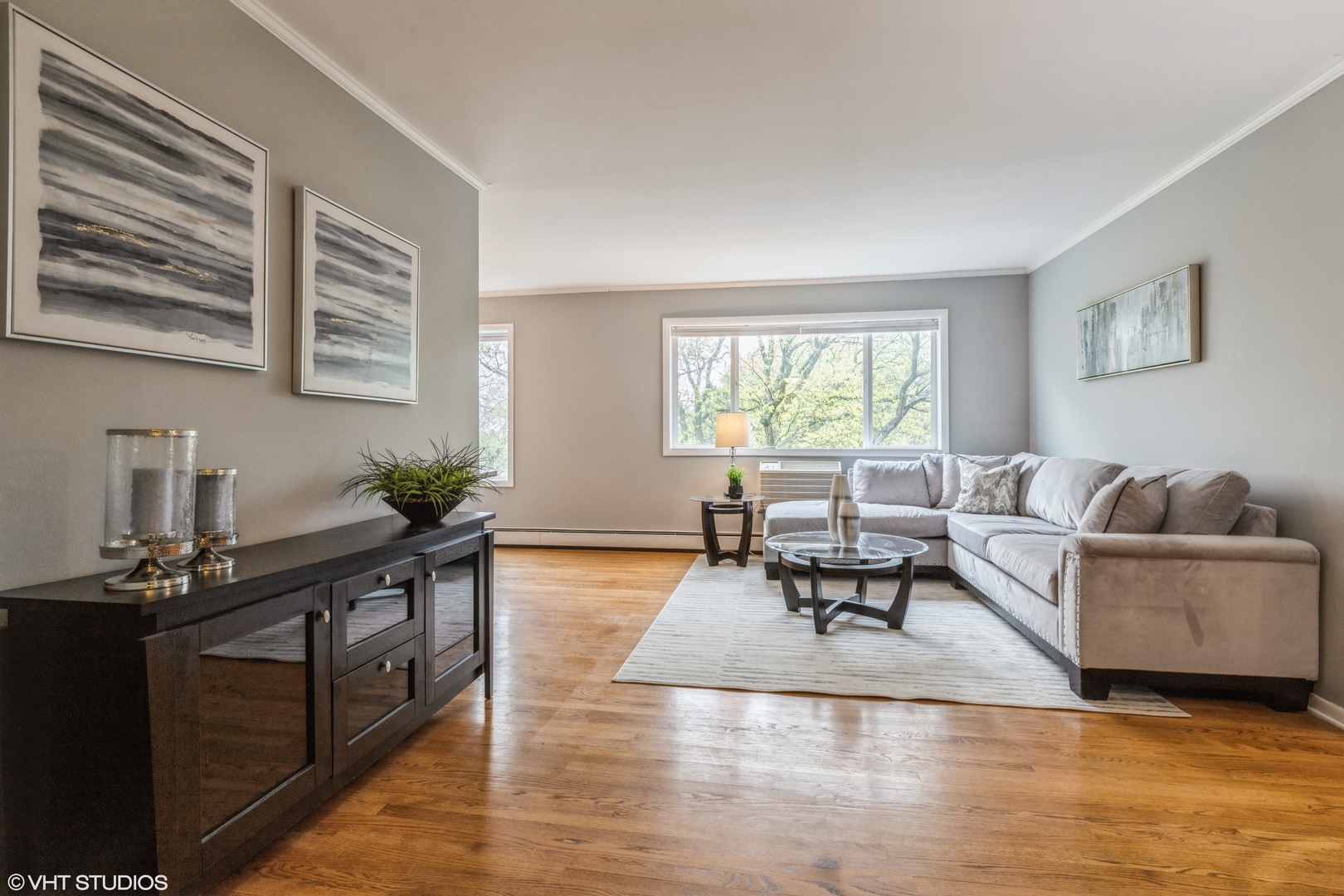 627 Ridge Road, Unit 401 Wilmette, IL 60091 - Photo 4 of 12 a living room with furniture and wooden floor