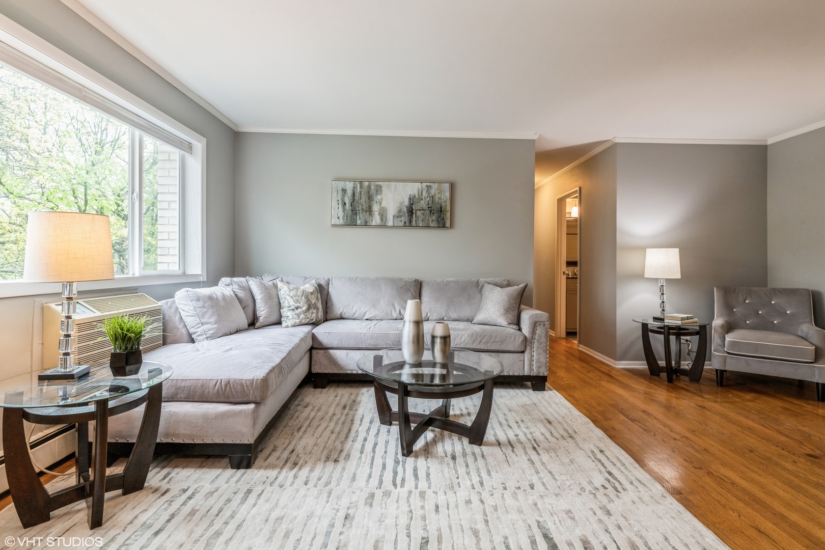 627 Ridge Road, Unit 401 Wilmette, IL 60091 - Photo 5 of 12 a living room with furniture and a table