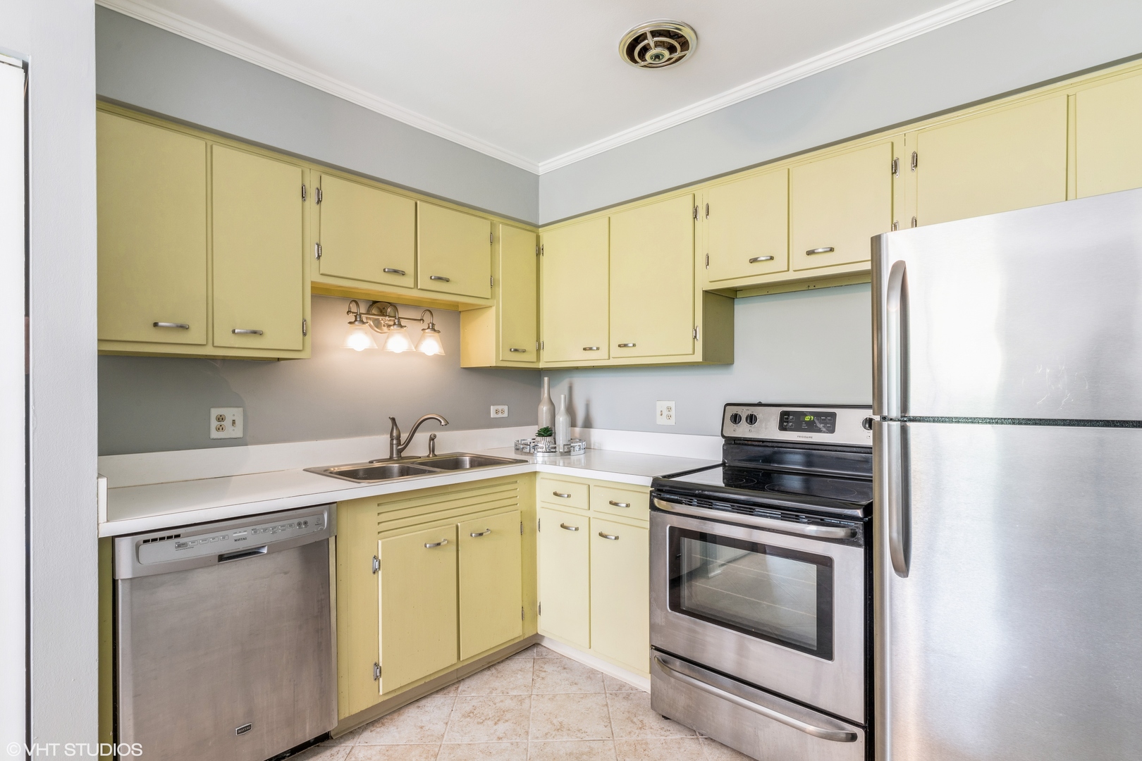 627 Ridge Road, Unit 401 Wilmette, IL 60091 - Photo 6 of 12 a kitchen with a white cabinets and white appliances
