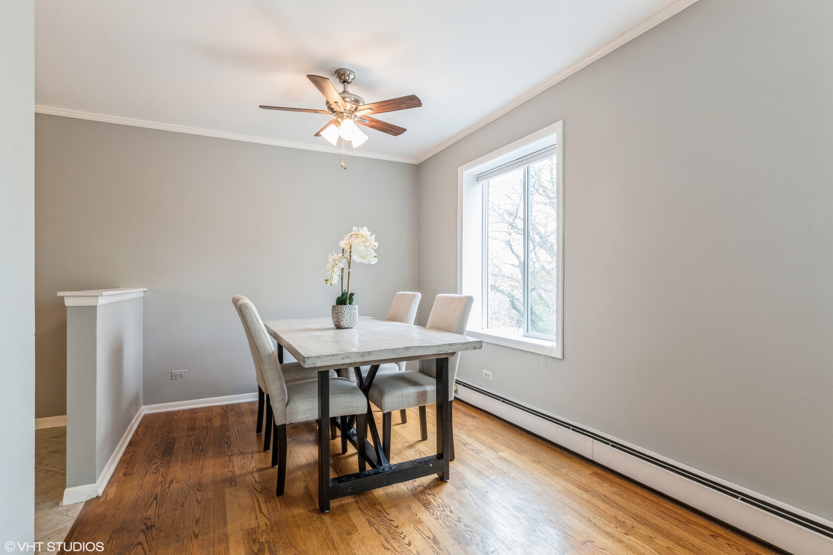 627 Ridge Road, Unit 401 Wilmette, IL 60091 - Photo 7 of 12 a view of a dining room with furniture window and wooden floor