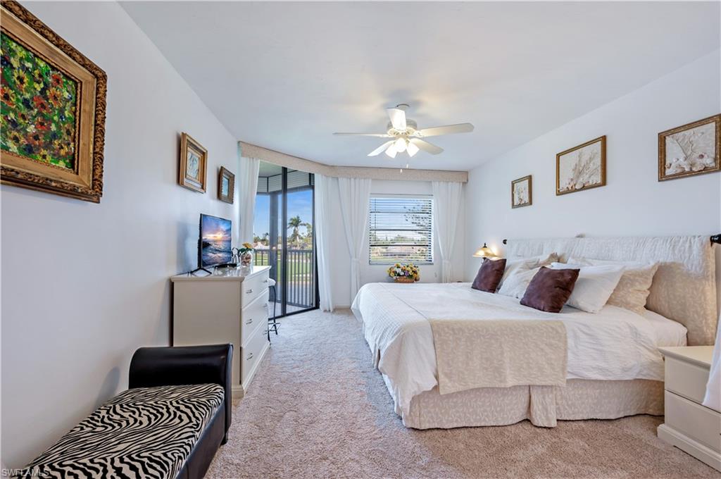 415 Augusta Boulevard, Unit 307 Naples, FL 34113 - Photo 20 of 36 a bedroom with a bed furniture and a window