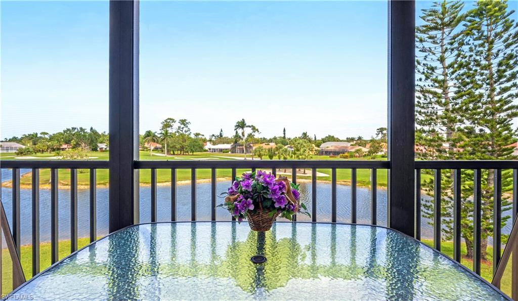 415 Augusta Boulevard, Unit 307 Naples, FL 34113 - Photo 28 of 36 a view of swimming pool from a balcony