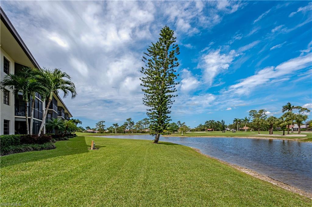 415 Augusta Boulevard, Unit 307 Naples, FL 34113 - Photo 31 of 36 a view of outdoor space with garden