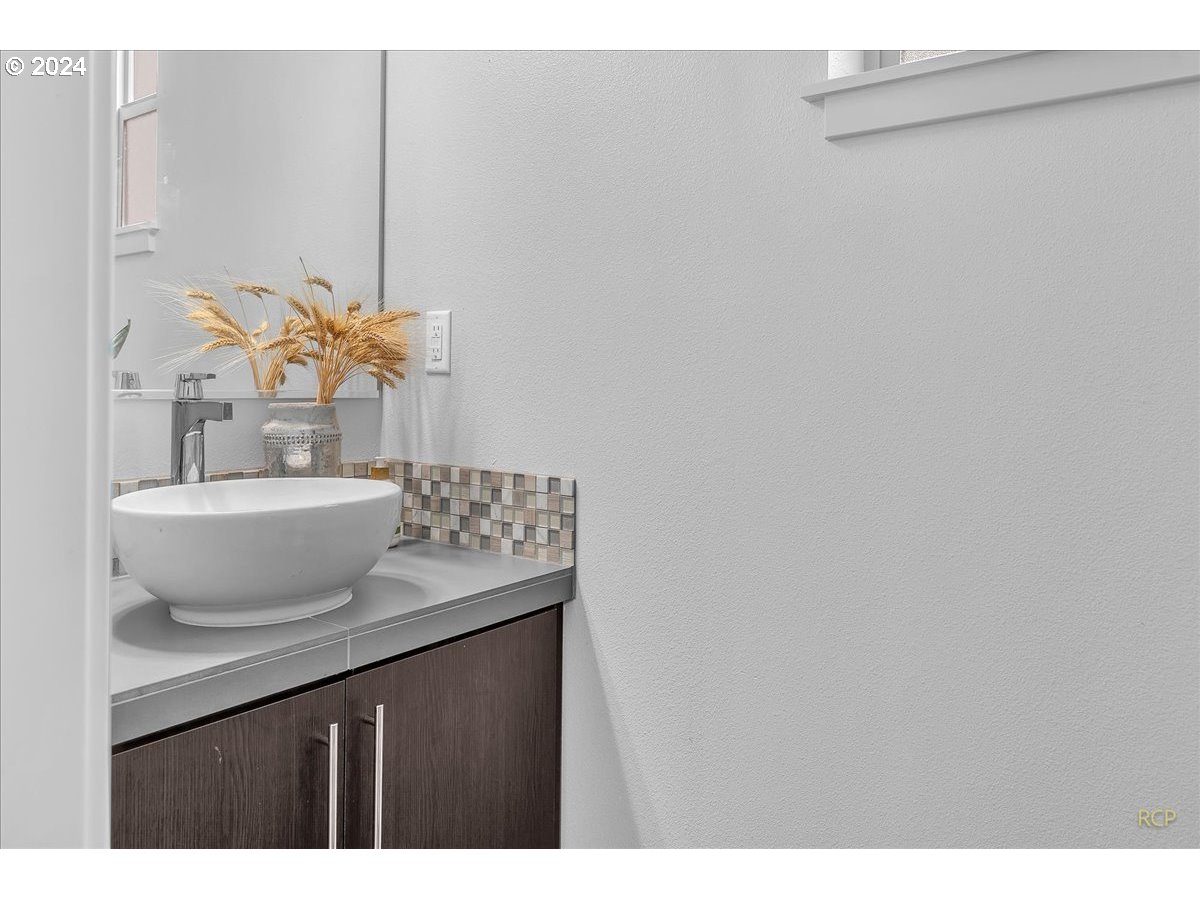 14465 Southwest Aiken Lane Beaverton, OR 97005 - Photo 12 of 30 a bathroom with a sink and a mirror