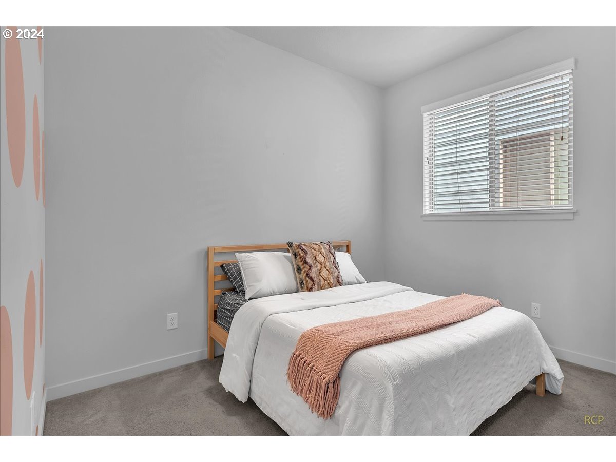 14465 Southwest Aiken Lane Beaverton, OR 97005 - Photo 20 of 30 a bedroom with a bed and a night stand