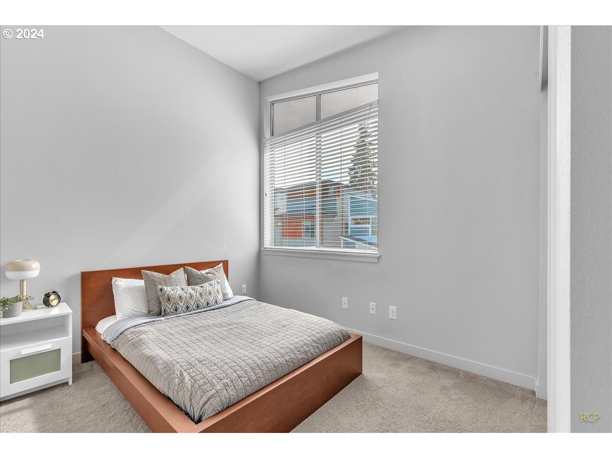 14465 Southwest Aiken Lane Beaverton, OR 97005 - Photo 21 of 30 a bedroom with a bed and window
