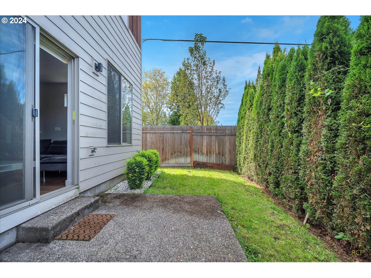 14465 Southwest Aiken Lane Beaverton, OR 97005 - Photo 24 of 30 a backyard of a house with lots of green space