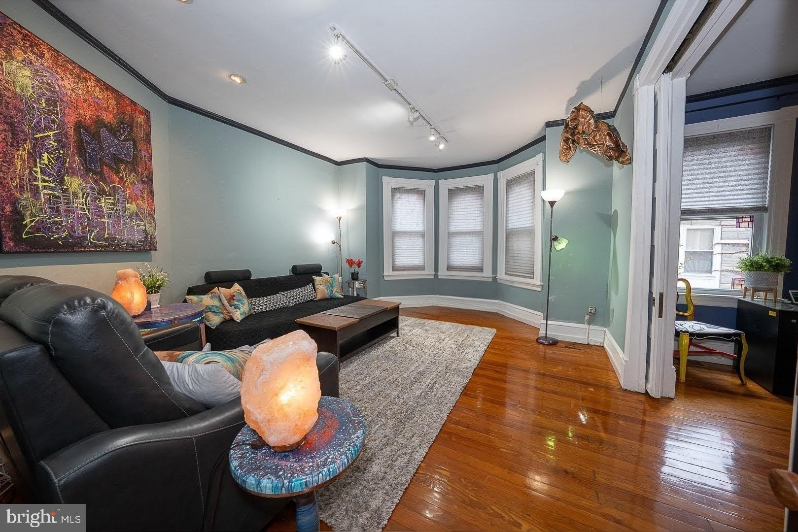 507 Morton Avenue Ridley Park, PA 19078 - Photo 11 of 42 a living room with furniture a rug and a large window