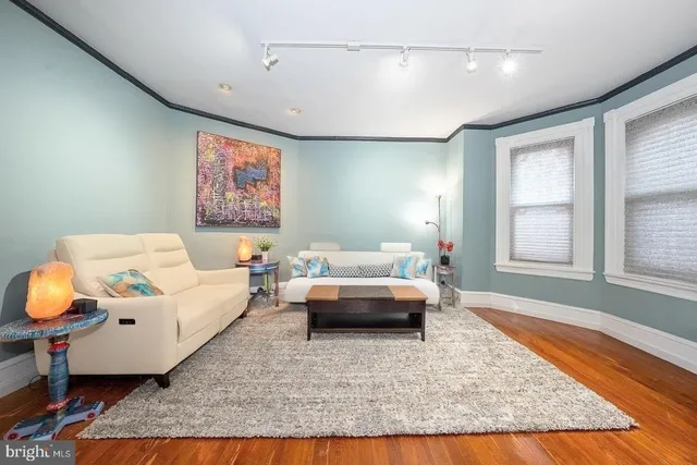 a living room with furniture and a rug