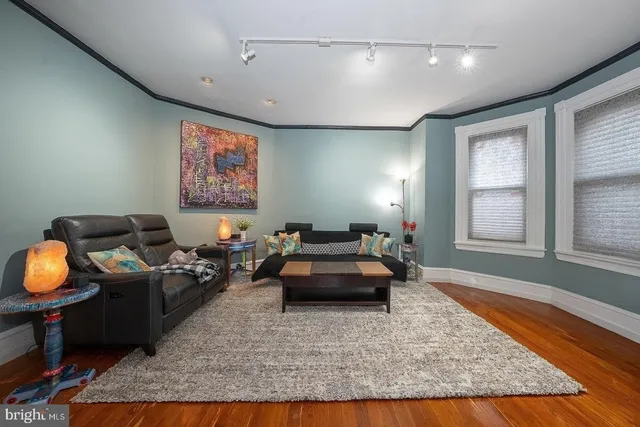 a living room with furniture and a rug
