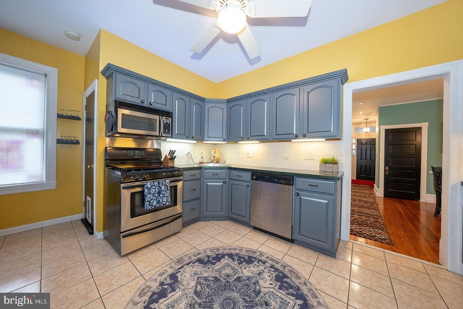 507 Morton Avenue Ridley Park, PA 19078 - Photo 16 of 42 a kitchen with stainless steel appliances granite countertop a stove top oven a sink and dishwasher