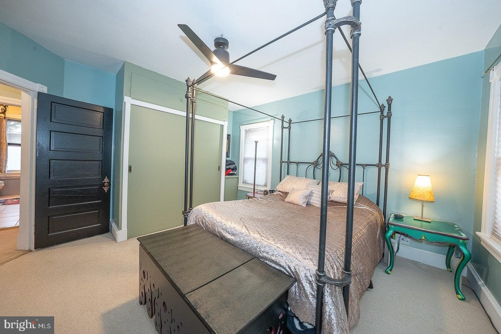 507 Morton Avenue Ridley Park, PA 19078 - Photo 22 of 42 a bedroom with a bed and a chandelier