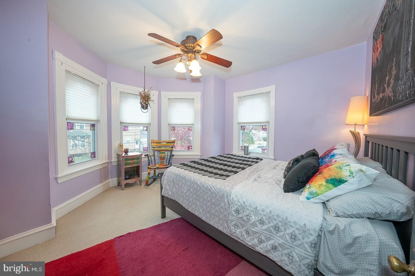 507 Morton Avenue Ridley Park, PA 19078 - Photo 25 of 42 a bedroom with a bed and a chandelier