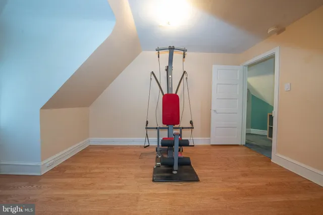 a bed room with a bed and a book shelf