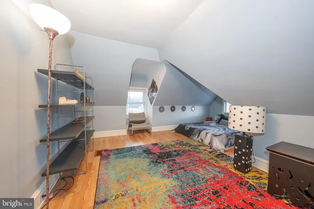 a room with gym equipment and a view of living room