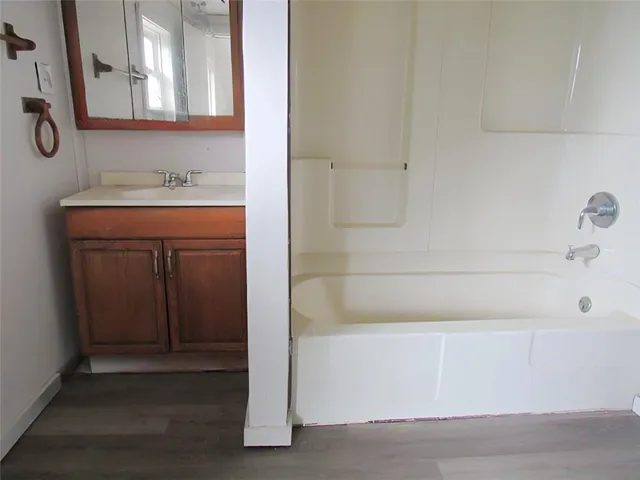 a bathroom with a sink and a mirror
