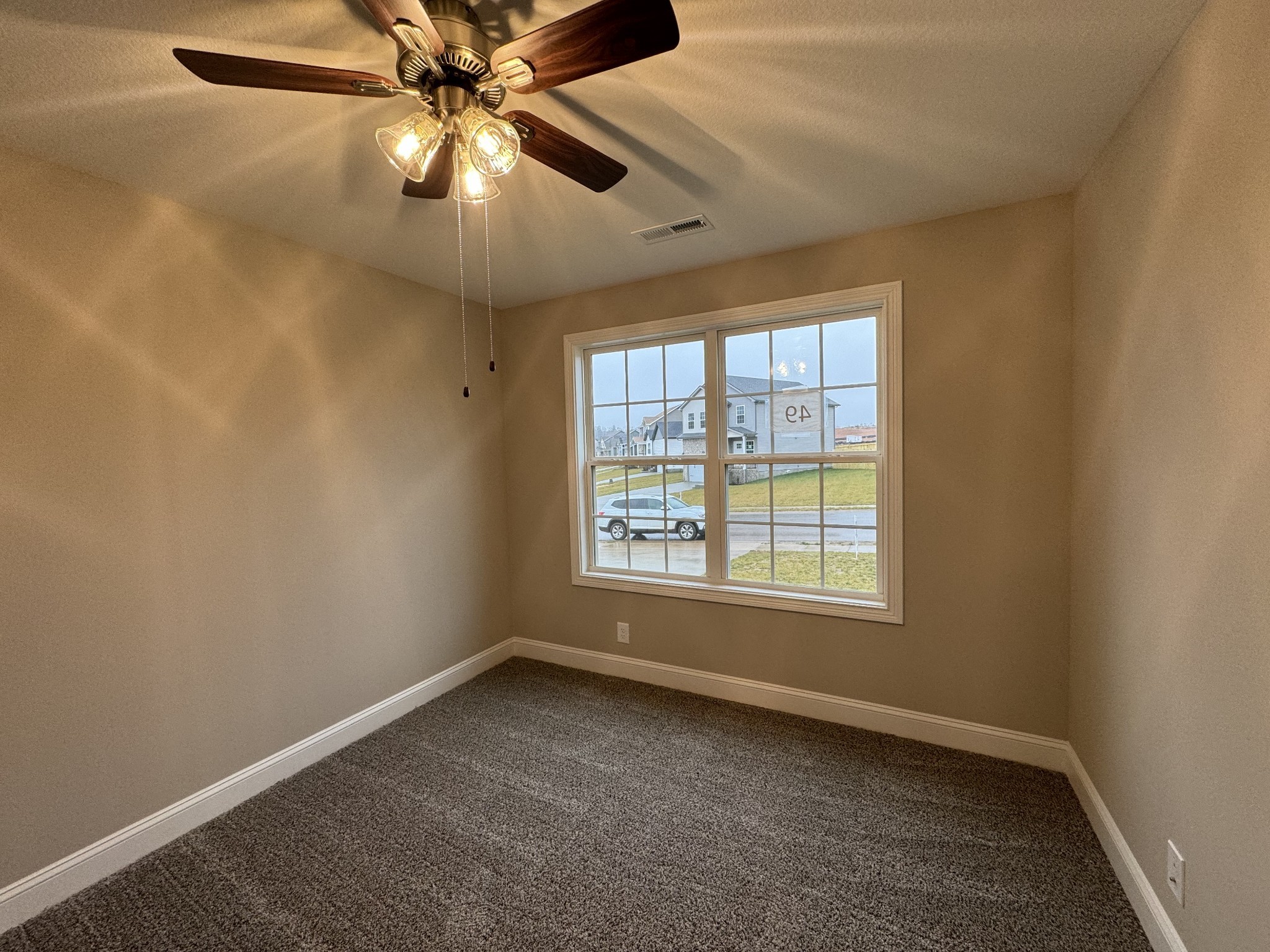 13 Echo Ridge Oak Grove, KY 42262 - Photo 19 of 24 an empty room with a window and a fan