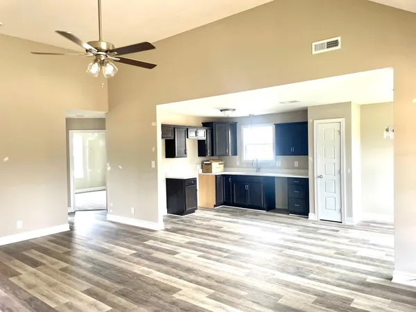 a view of a kitchen with a sink and a window